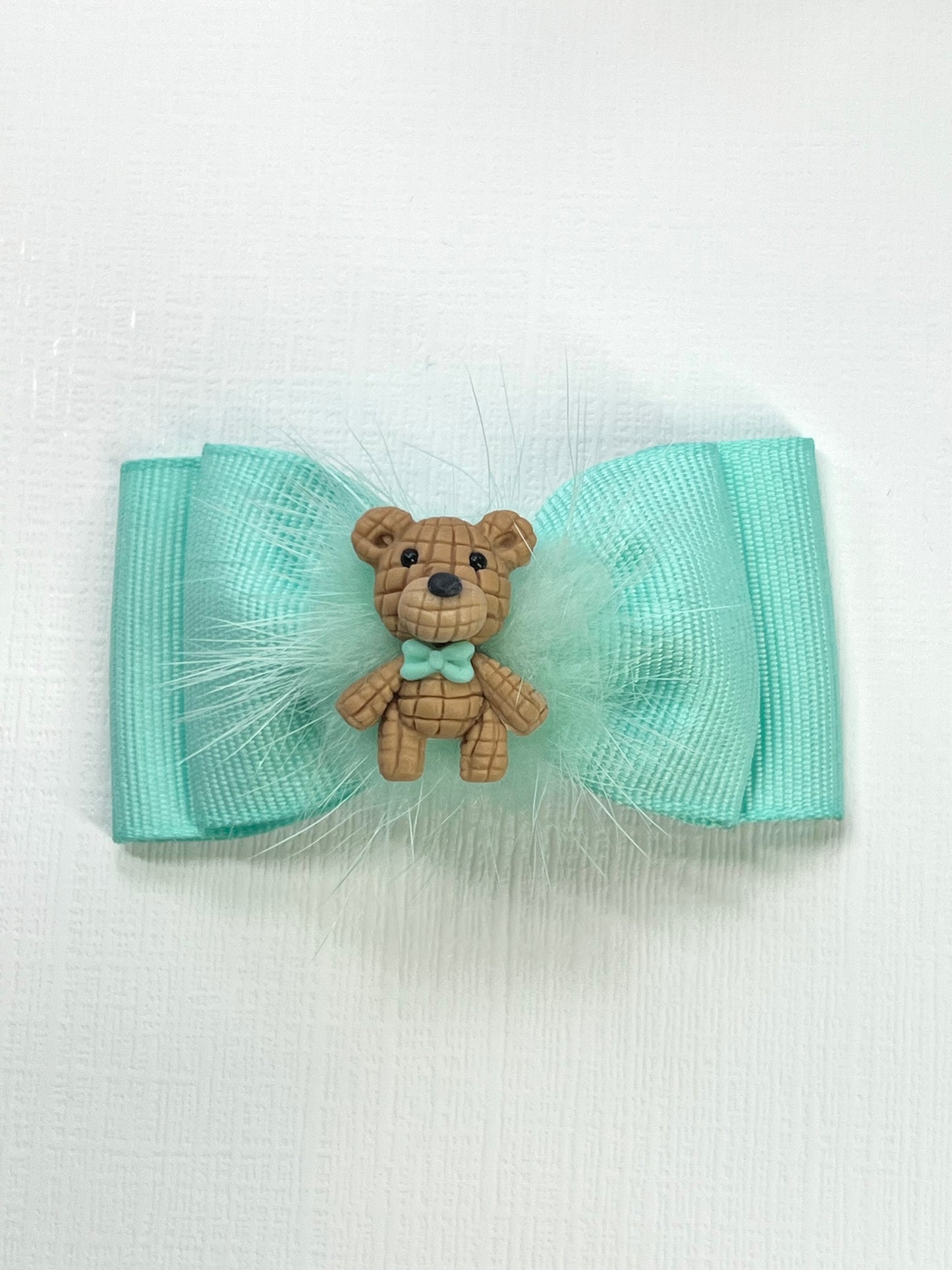 Adorn your Little Cutie with this Adorable Teddy Bear  Girl Hair Clips Bow. Hair clips Bow with a Clay Doll in the center of it.